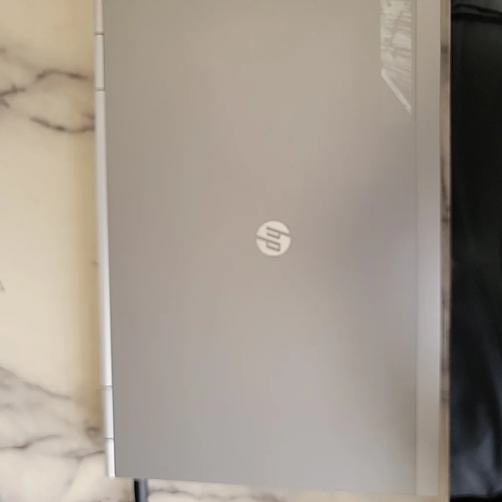 HP Silver and Black Laptop with Sleek Design and QWERTY Keyboard